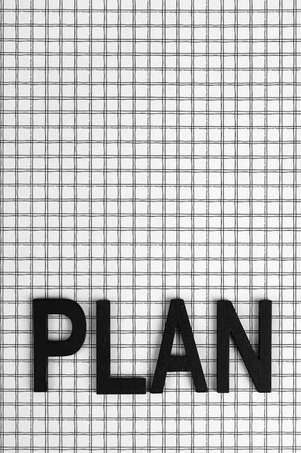 Black letters spelling 'PLAN' on a grid pattern background, ideal for planning concepts.